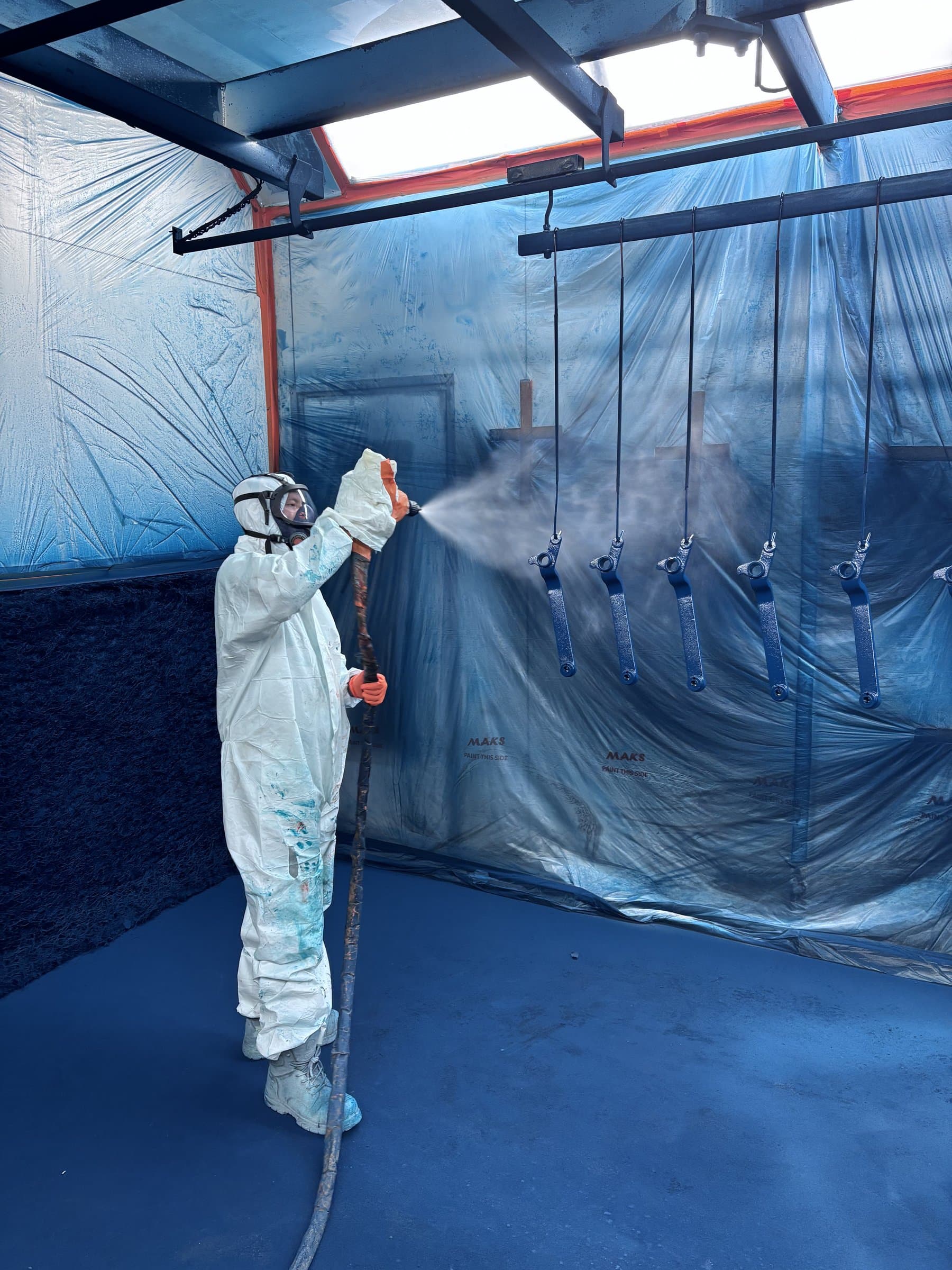 Industrial painting booth in action