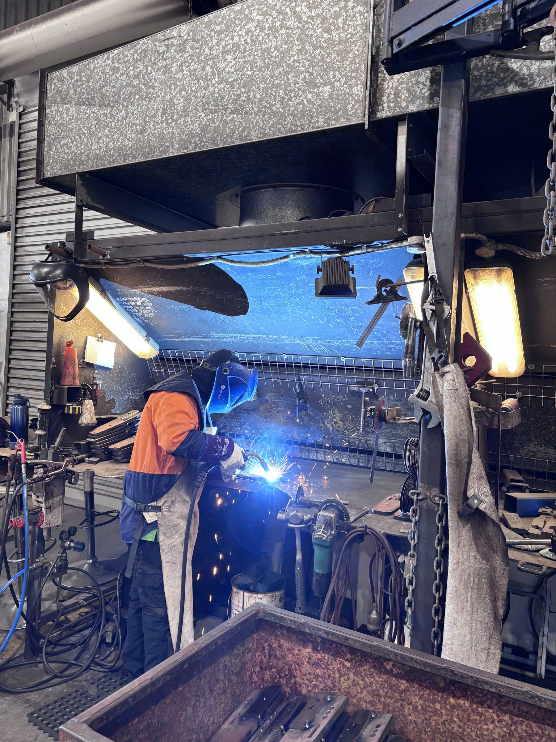 Arc welding with sparks at EdgeTech fabrication workshop